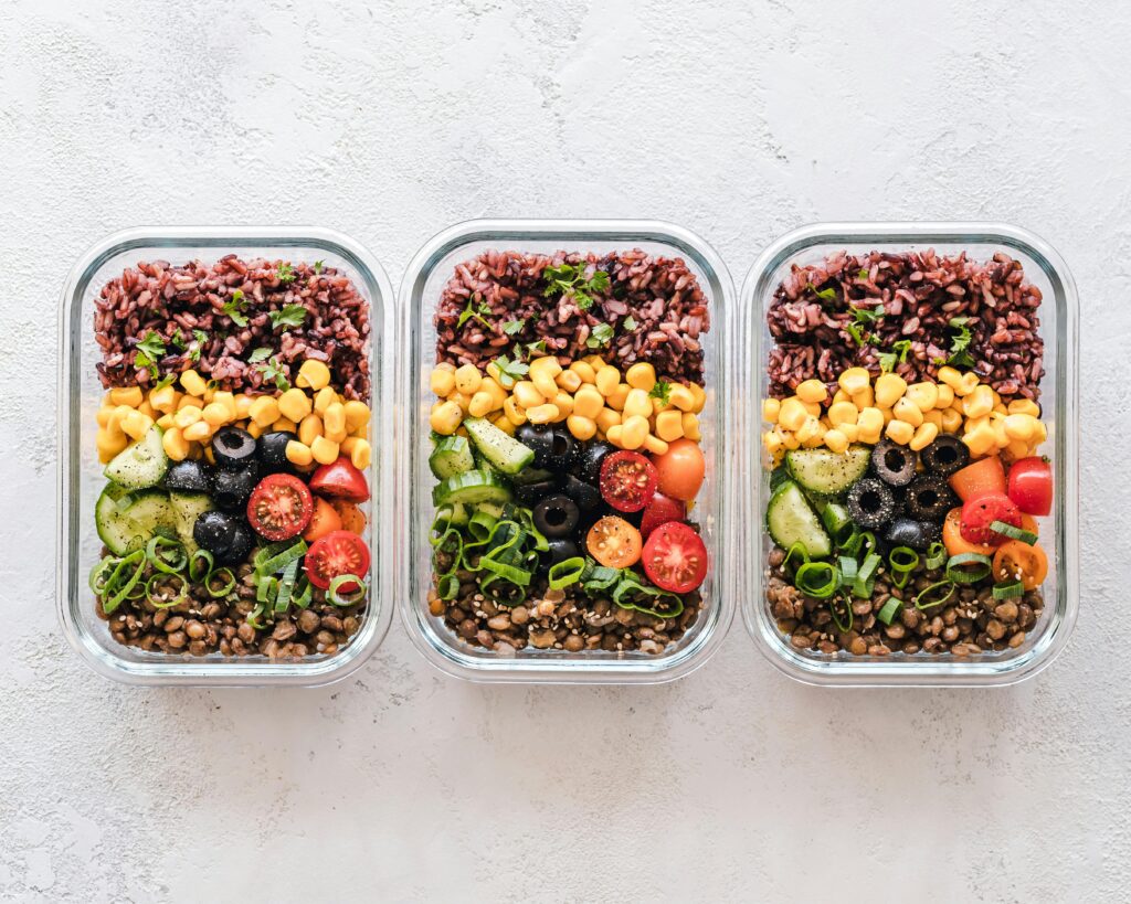 pexels photo 1640775 1640775 Colorful healthy meal prep with corn, olives, tomatoes, and lentils in glass containers. Perfect for mindful eating.